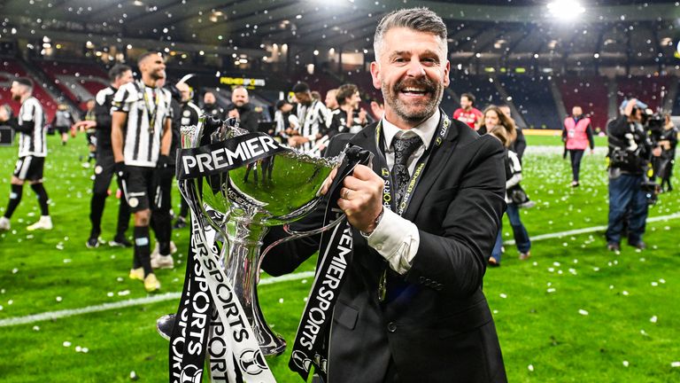 GLASGOW, SCOTLAND - DECEMBER 14: St Mirren Manager Stephen Robinson celebrates with the Premier Sports Cup Trophy at full time during a Premier Sports Cup Final match between St Mirren and Celtic at Barclays Hampden, on December 14, 2025, in Glasgow, Scotland. (Photo by Paul Devlin / SNS Group)