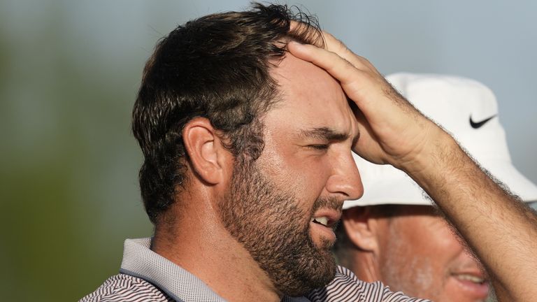 Scottie Scheffler, of the United States, reacts after the 18th hole during the final round of the Hero World Challenge