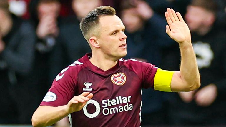 Lawrence Shankland high-fives a team-mate after pulling a goal back for Hearts against Hibernian