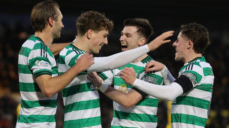 Arne Engels celebrates with his team-mates after scoring Celtic's fourth goal from the penalty spot