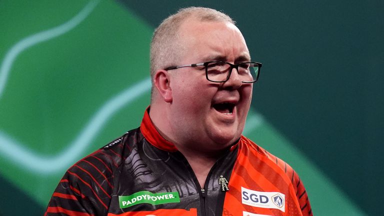 Stephen Bunting celebrates defeating Sebastian Bialecki on day four of the Paddy Power World Darts Championship at the Alexandra Palace, Lon