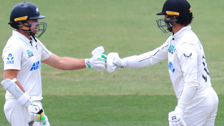 Tom Latham and Devon Conway of New Zealand bump fists during day four of the Third Test match in the against West Indies