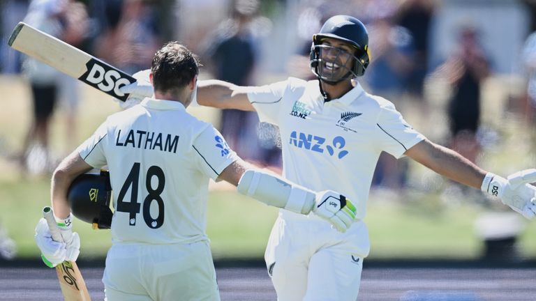 Tom Latham celebrates with teammate Rachin Ravindra after making 100 runs against the West Indies (Andrew Cornaga/Photosport via AP)