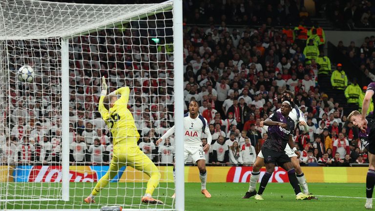Slavia's David Zima, right, scores an own goal during the Champions League opening phase soccer match between Tottenham and Slavia Prague, in London, England, Tuesday, Dec. 9, 2025. (AP Photo/Richard Pelham)