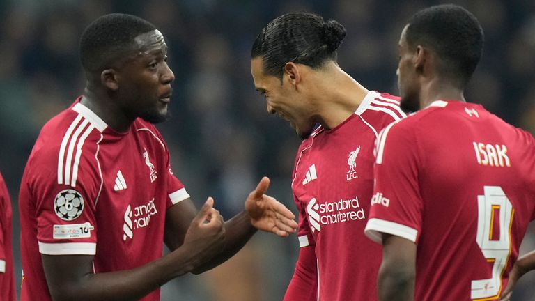 Liverpool's Ibrahima Konate, left, speaks to Liverpool's Virgil van Dijk during a Champions League, league phase, soccer match between Inter Milan and Liverpool in Milan, Italy, Tuesday, Dec.9, 2025. (AP Photo/Luca Bruno)