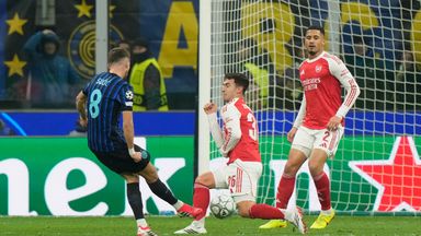 Inter Milan's Petar Sucic, left, scores his team's first goal during the opening phase of the soccer match between Inter Milan and Arsenal in Milan, Italy, Tuesday, January 20, 2026. (AP Photo/Luca Bruno)