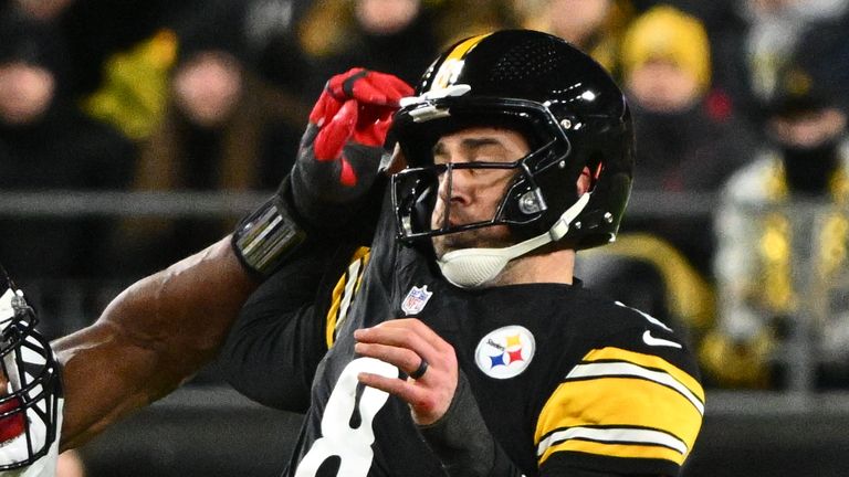 Pittsburgh Steelers quarterback Aaron Rodgers (8) loses possession of the ball while being tackled by Houston Texans defensive end Danielle Hunter (55) during the second half of an NFL wild-card playoff football game, Monday, Jan. 12, 2026, in Pittsburgh. (AP Photo/Justin Berl)