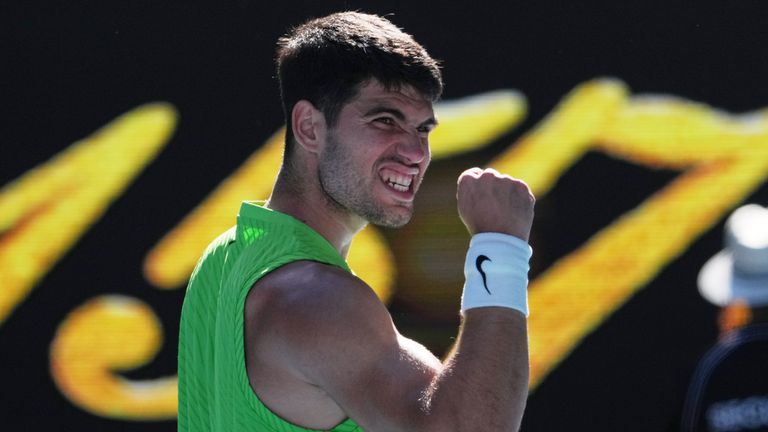 Carlos Alcaraz of Spain celebrates after defeating Yannick Hanfmann of Germany in their second round match at the Australian Open tennis championship in Melbourne, Australia, Wednesday, Jan. 21, 2026. (AP Photo/Dita Alangkara)