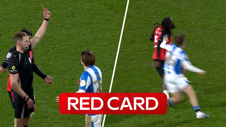 Huddersfield Town's Alfie May sees a red card produced to him after apparent hair pull on Luton Town's Kasey Palmer. 