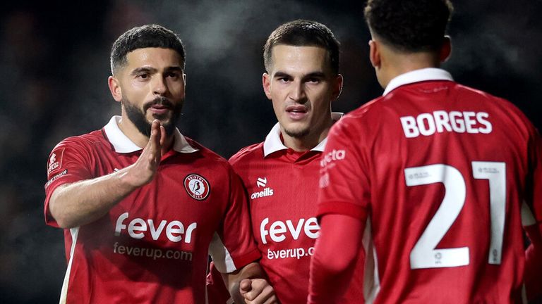 Anis Mehmeti celebrates with his team-mates after doubling Bristol City's lead against Watford
