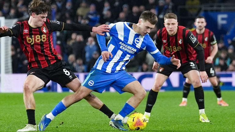 Bournemouth's Alex Scott and Brighton and Hove Albion's Brajan Gruda (right) battle for the ball