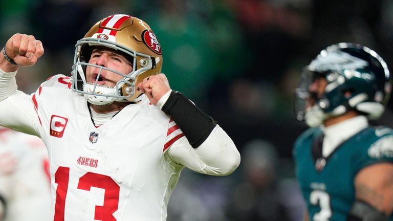 San Francisco 49ers quarterback Brock Purdy (13) reacts to a touchdown pass to 49ers running back Christian McCaffrey during the second half of an NFL wild-card playoff football game against the Philadelphia Eagles on Sunday, Jan. 11, 2026, in Philadelphia. (AP Photo/Chris Szagola)