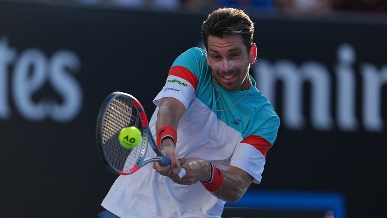 Cameron Norrie of Britain plays a backhand return to Benjamin Bonzi of France during their first round match at the Australian Open tennis championship in Melbourne, Australia, Sunday, Jan. 18, 2026. (AP Photo/Asanka Brendon Ratnayake)