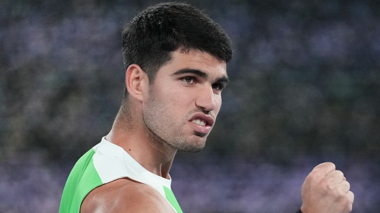 Carlos Alcaraz of Spain celebrates after defeating Adam Walton of Australia in their first round match at the Australian Open tennis championship in Melbourne, Australia, Sunday, Jan. 18, 2026. (AP Photo/Dita Alangkara)