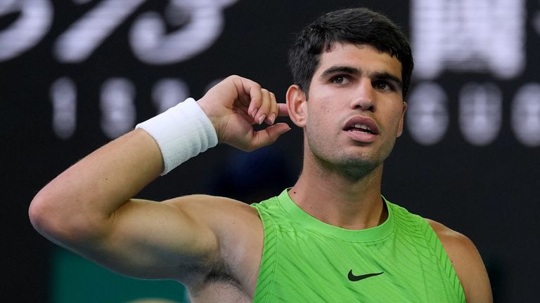 Carlos Alcaraz of Spain reacts during his semifinal match against Alexander Zverev of Germany at the Australian Open tennis championship in Melbourne, Australia, Friday, Jan. 30, 2026. (AP Photo/Dita Alangkara)