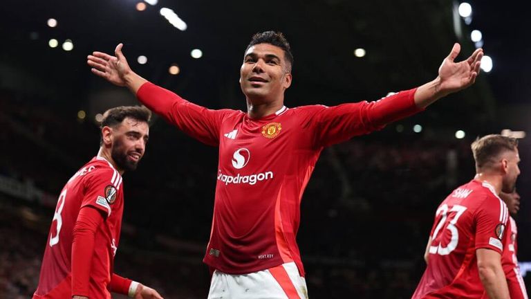 Manchester United's Casemiro raises his arms in celebration at Old Trafford.
Robbie Jay Barratt - AMA/Getty Images