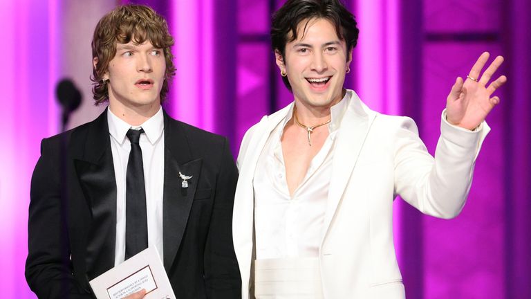 Connor Storrie (L) and Hudson Williams speak onstage during the Golden Globes earlier this month