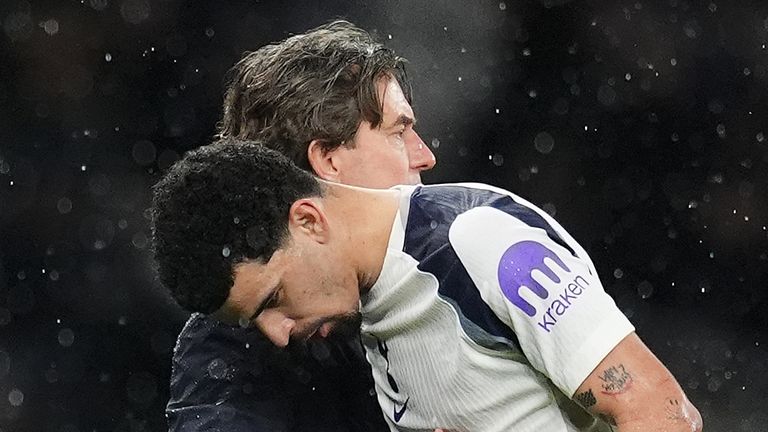 Tottenham Hotspur manager Thomas Frank (left) embraces Dominic Solanke as he leaves the pitch vs Borussia Dortmund