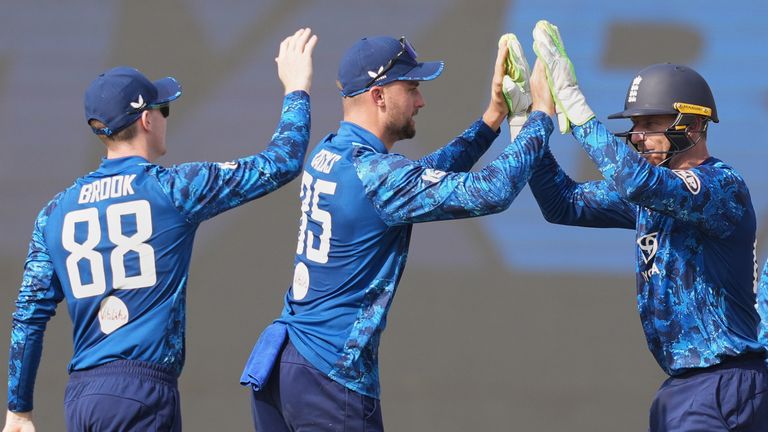 England's Jos Buttler and Will Jacks celebrate a wicket in ODI cricket (Associated Press)