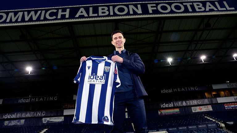Eric Ramsay holds a West Bromwich Albion home shirt as he is unveiled as the new Head Coach at The Hawthorns