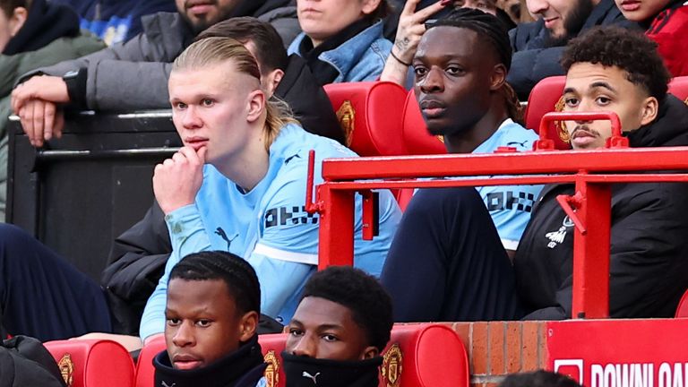 A dejected Erling Haaland looks on from the substitutes bench