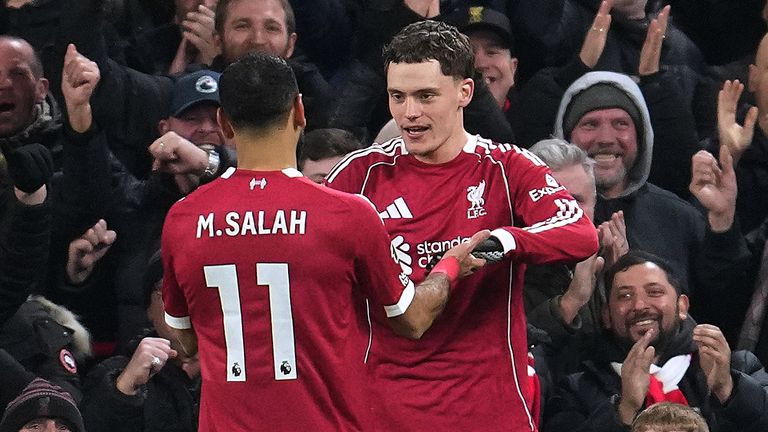 Florian Wirtz and Mohamed Salah celebrate after Liverpool extend their lead over Newcastle (AP Photo/Jon Super)