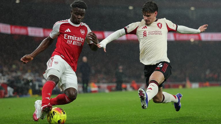 Liverpool's Milos Kerkez blocks Arsenal's Bukayo Saka
