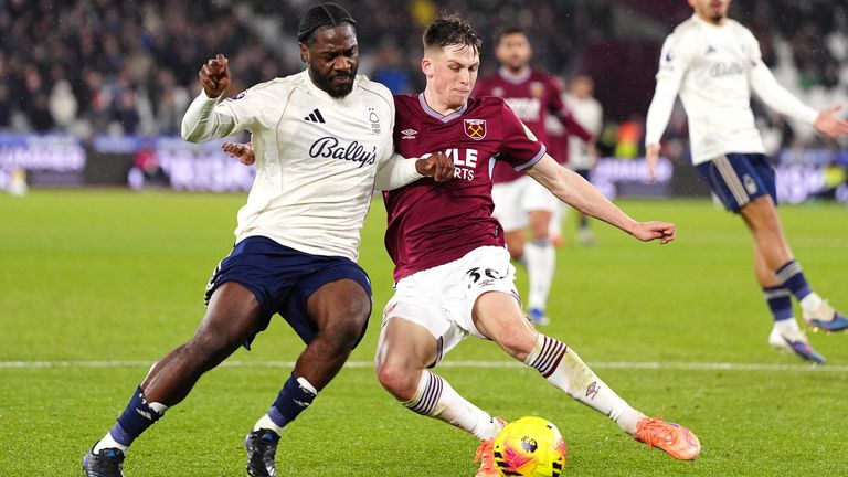 Nottingham Forest's Ola Aina (left) and West Ham United's Oliver Scarles battle for the ball