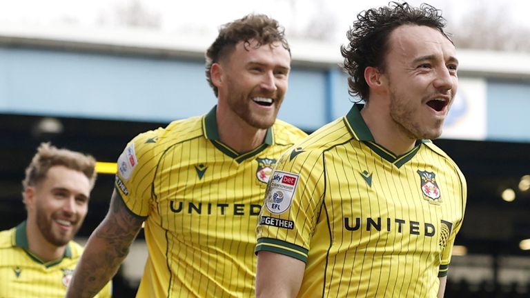 Wrexham's Oliver Rathbone celebrates after scoring their second goal against Blackburn Rovers