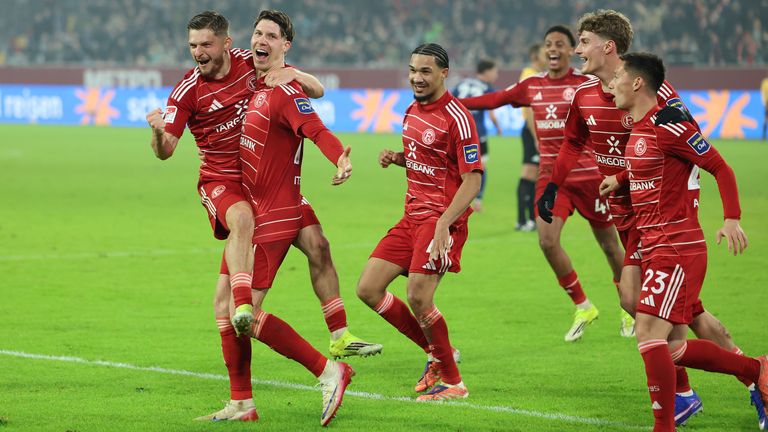 Fortuna Dusseldorf players celebrate their late winner against Arminia Bielefeld