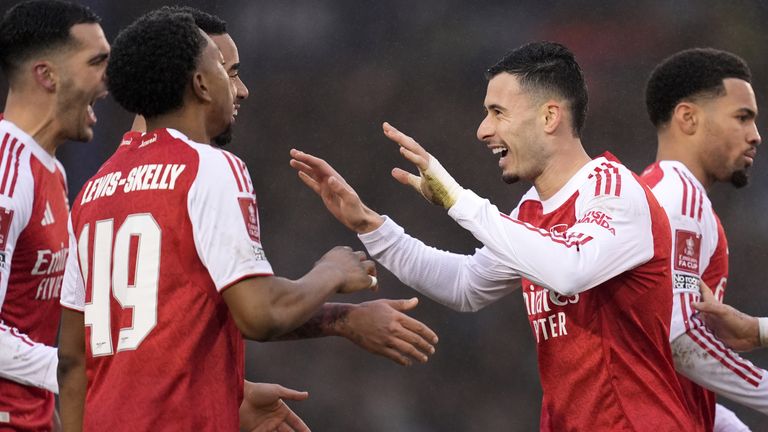 Gabriel Martinelli celebrates with his Arsenal team-mates after scoring a hat-trick in the FA Cup third round match against Portsmouth
