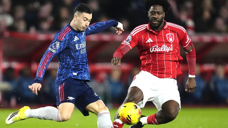 Arsenal's Gabriel Martinelli (left) and Nottingham Forest's Ola Aina battle for the ball