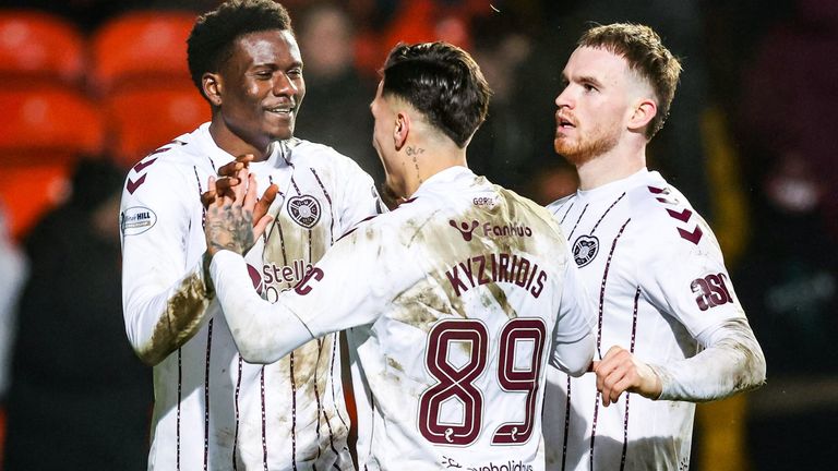 DUNDEE, SCOTLAND - JANUARY 31: Hearts' Pierre Landry Kabore (L) celebrates scoring to make it 3-0 with Alexandros Kyziridis and Marc Leonard during a William Hill Premiership match between Dundee United and Heart of Midlothian at The CalForth Construction Arena at Tannadice Park, on January 31, 2026, in Dundee, Scotland. (Photo by Ross Parker / SNS Group)