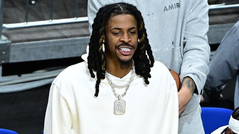 Ja Morant stands and watches the action from courtside at the NBA Berlin Game (TimGroothuis/picture-alliance/dpa/AP Images)