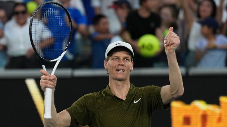 Jannik Sinner of Italy celebrates after defeating his compatriot Luciano Darderi in their fourth round match at the Australian Open tennis c