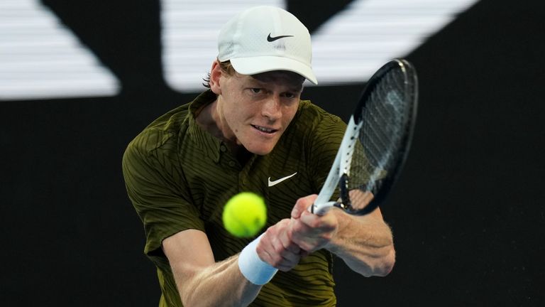 Jannik Sinner of Italy plays a backhand return to his compatriot Luciano Darderi during their fourth round match at the Australian Open tenn