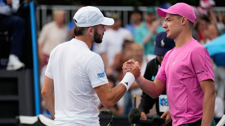 Kamil Majchrzak, right, of Poland is congratulated by Jacob Fearnley of Britain following their first round match at the Australian Open ten