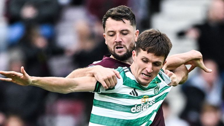 EDINBURGH, SCOTLAND - OCTOBER 26: Celtic's Johnny Kenny (L) and Hearts' Craig Halkett in action during a William Hill Premiership match between Heart of Midlothian and Celtic at Tynecastle Park, on October 26, 2025, in Edinburgh, Scotland. (Photo by Paul Devlin / SNS Group)