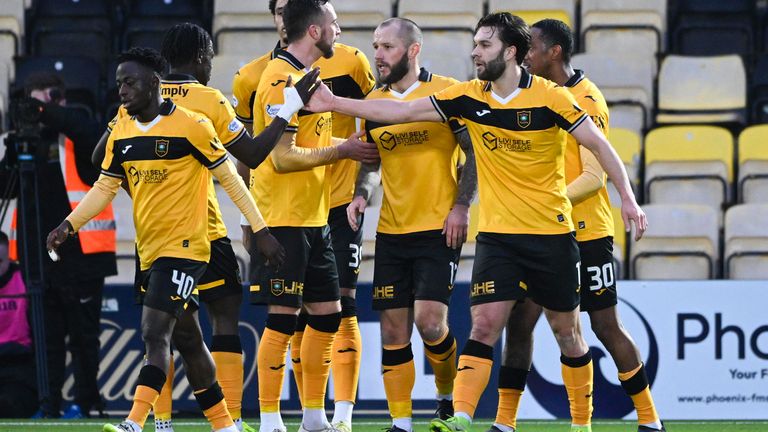 Livingston's Connor McLennan (R) celebrates with his team mates after scoring to make it 1-0 at the Set Fare Arena