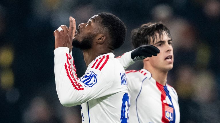 Lyon's Ainsley Maitland-Niles, left, celebrates after scoring to the opening goal against Young Boys