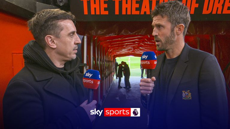 Michael Carrick speaks to Gary Neville ahead of Manchester Derby