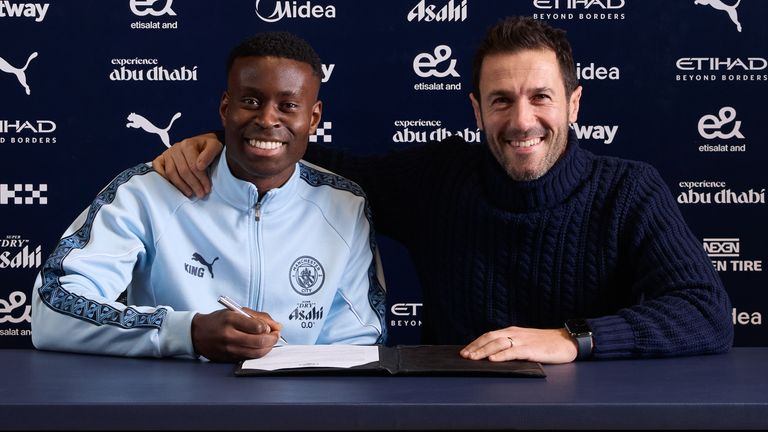 Marc Guhi and Man City director of football Hugo Viana. Credit: Tom Barton/Manchester City FC