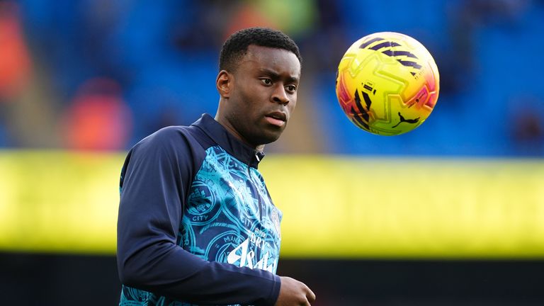 New signing Marc Guehi warms up ahead of his Premier League debut for Manchester City against Wolves