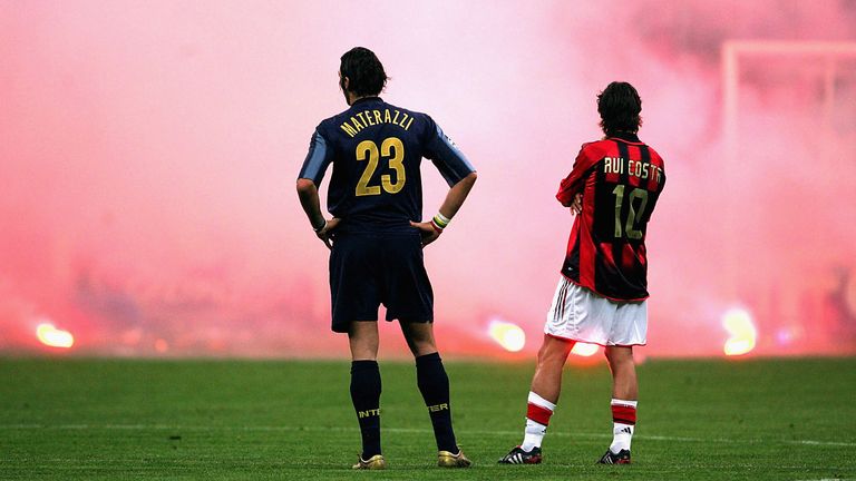Marco Materazzi of Inter Milan and Rui Costa of AC Milan look on during the Champions League quarter-final second leg at San Siro in 2005