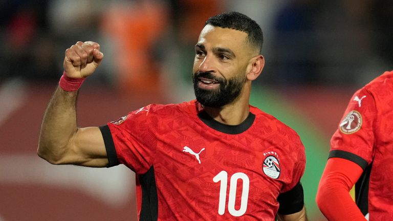 Egypt's Mohamed Salah, left, celebrates after scoring his side's third goal during the Africa Cup of Nations quarterfinal soccer match between Egypt and Ivory Coast, in Agadir, Morocco, Saturday, Jan. 10, 2026. (AP Photo/Mosa'ab Elshamy)