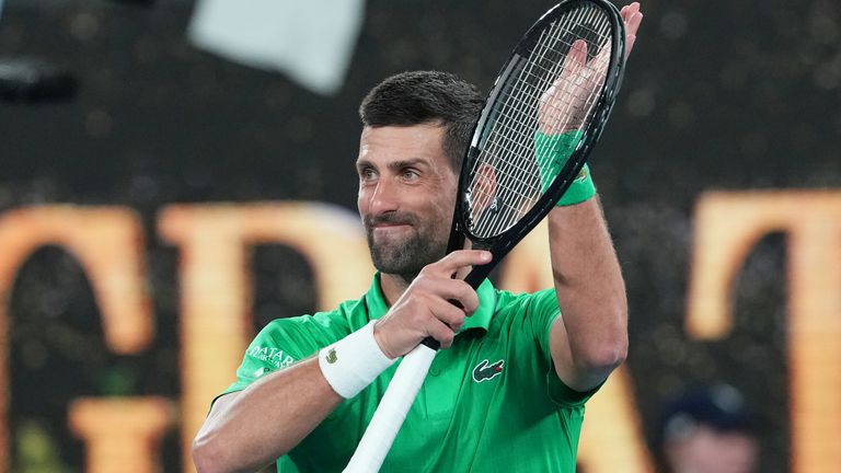 Novak Djokovic of Serbia celebrates after defeating Pedro Martinez of Spain in their first round match at the Australian Open tennis champio