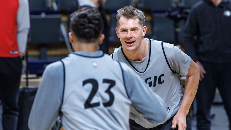 Moe Wagner and Tristan Da Silva exchange passes during training for the Orlando Magic in Berlin