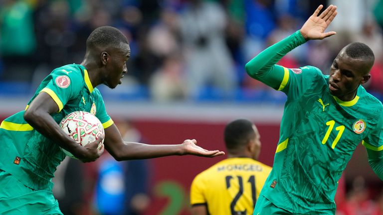 Senegal's Pape Alassane Gueye carries the ball after scoring against Sudan