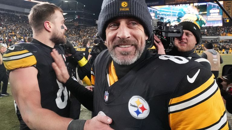 Pittsburgh Steelers quarterback Aaron Rodgers greets tight end Pat Freiermuth after an NFL football game against the Baltimore Ravens