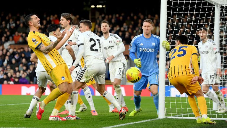Lewis Dunk reacts after his goal-bound effort is blocked by team-mate Diego Gomez